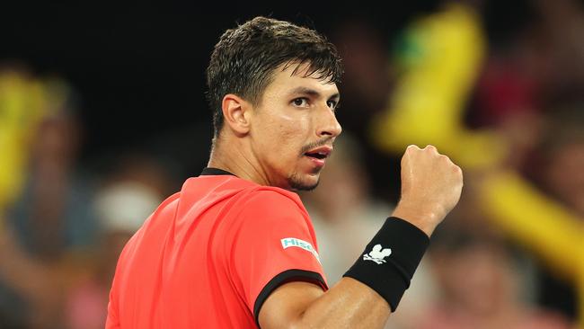 MELBOURNE, AUSTRALIA – JANUARY 14: Alexei Popyrin of Australia celebrates a point against Corentin Moutet of France in the Men's Singles First Round match during day three of the 2025 Australian Open at Melbourne Park on January 14, 2025 in Melbourne, Australia. (Photo by Kelly Defina/Getty Images)