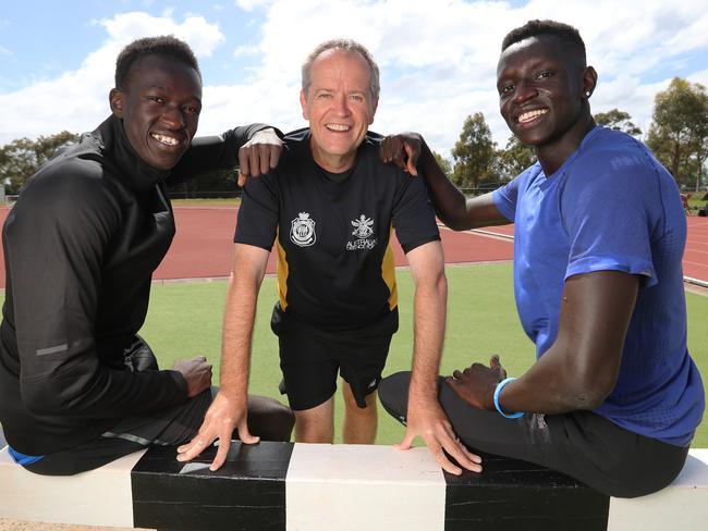 Australian 800m record holder Joseph Deng [left], training partner Peter Bol [right] and Opposition Leader Bill Shorten in Melbourne.Joseph Deng and training partner Peter Bol are both Sudanese and they struck trouble trying to rent a house. With help from Athletics Australia and Shorten, they now have a house after Deng had been living on an uncle's couch for the past year.Picture: Alex Coppel.