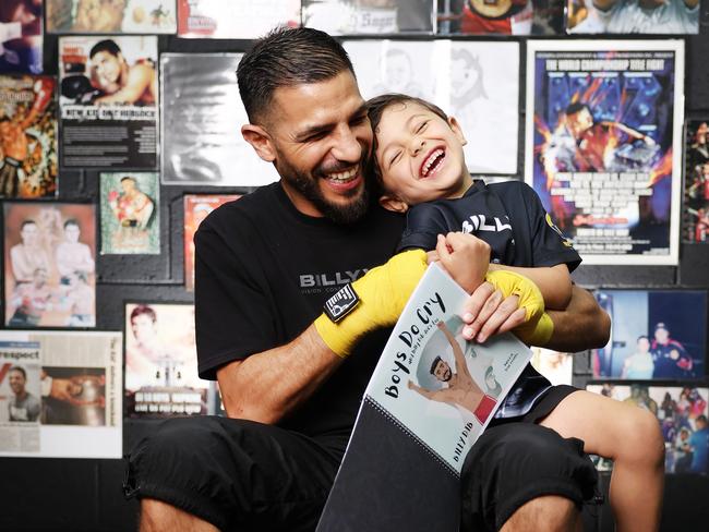 Former world champion boxer Billy Dib with son Laith Dib, and his new book Boys Do Cry. Picture: Rohan Kelly.