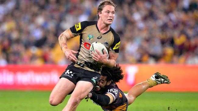 Panthers skipper Matt Moylan breaks through Broncos’ defence at Suncorp Stadium on July 22. Picture: Bradley Kanaris/Getty Images.