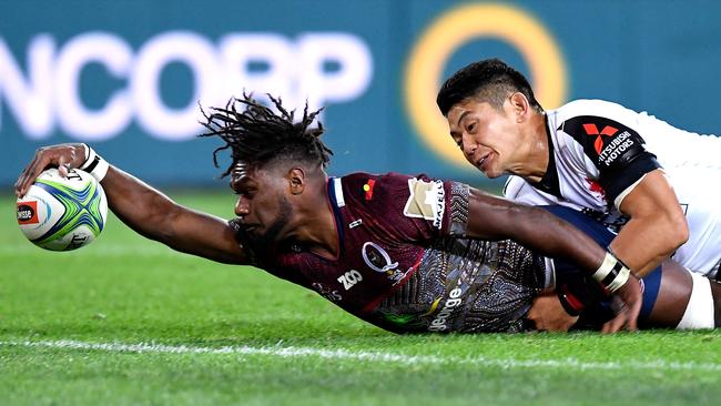 Moses Sorovi of the Reds scores a try at Suncorp Stadium in Brisbane.