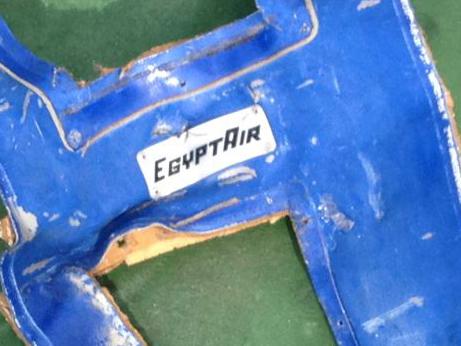 TOPSHOT - A picture uploaded on the official Facebook page of the Egyptian military spokesperson on May 21, 2016 and taken from an undisclosed location reportedly shows some debris that the search teams found in the sea after the EgyptAir Airbus A320 crashed in the Mediterranean. The Egyptian military spokesman released pictures on his Facebook page of some of the wreckage it recovered so far, including a safety vest and what appeared to be the shredded remains of a seat. EgyptAir flight MS804 sent automated messages signalling smoke onboard before plunging into the Mediterranean, the French aviation safety agency said, as search teams hunted for more wreckage. / AFP PHOTO / Egyptian military spokesperson's facebook page / HO / ===RESTRICTED TO EDITORIAL USE - MANDATORY CREDIT 