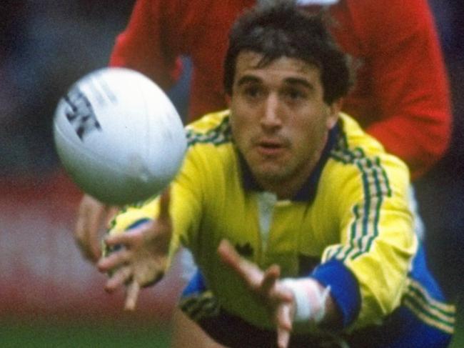 1988: Daniel Neaga (centre) of Romania passes the ball during the match against Wales at Cardiff Arms Park in Cardiff, Wales. Romania won the match 15-9. \ Mandatory Credit: Russell Cheyne/Allsport