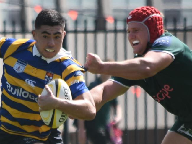 Dane Mitchell tries to evade the tackle of Wyatt Ballenger. Picture: Sean Teuma. SRU Premiership 1st Colts Round 2 - Sydney University vs Randwick at St Andrews College, 12 April 2025