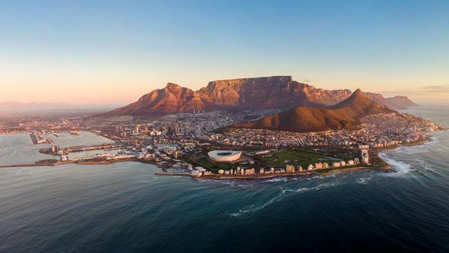 Aerial panoramic view of Cape Town cityscape at sunset.