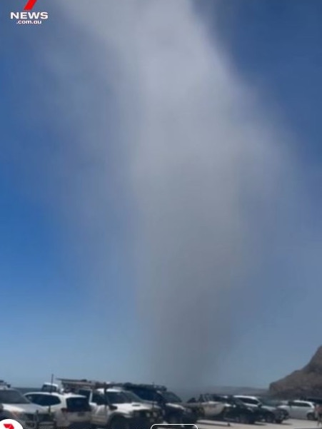 Beachgoers flee a willy-willy at Rapid Bay, south of Adelaide. Picture: 7NEWS