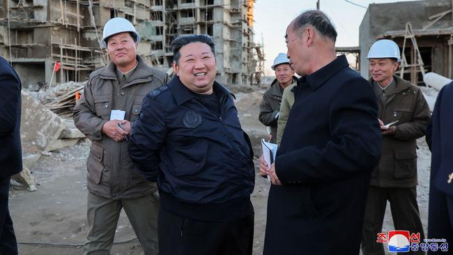 Kim Jong-un, second left, visits a flood restoration construction site in North Pyongan Province following flooding from heavy rain during the summer. Picture: AFP