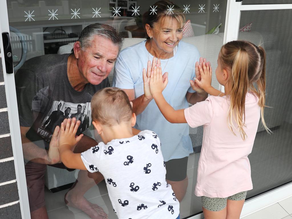 Grandkids had to visit their grandparents through the glass at the front door. Picture: Rohan Kelly