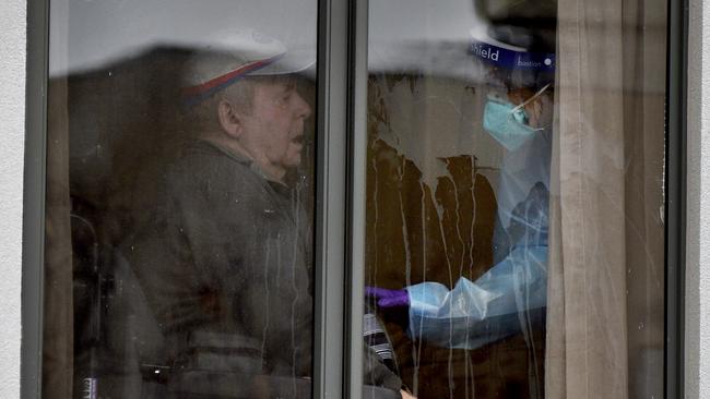 A resident at Arcare Maidstone Aged Care in Melbourne's west is attended to by a staff member. Picture: NCA NewsWire / Andrew Henshaw