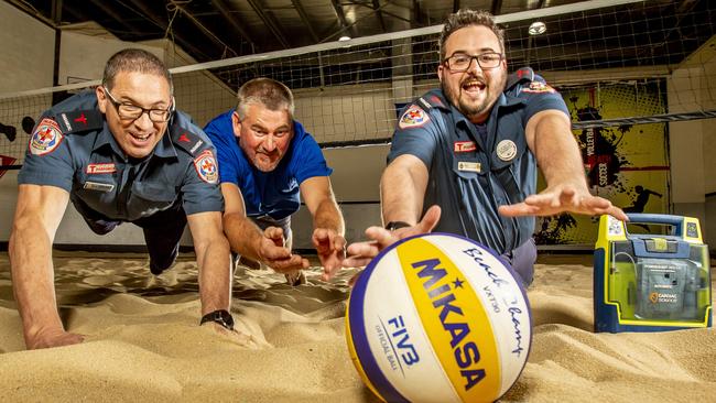 Colin Rooney (centre) with paramedics Paul Viti and Sam Williams. Picture: Tim Carrafa