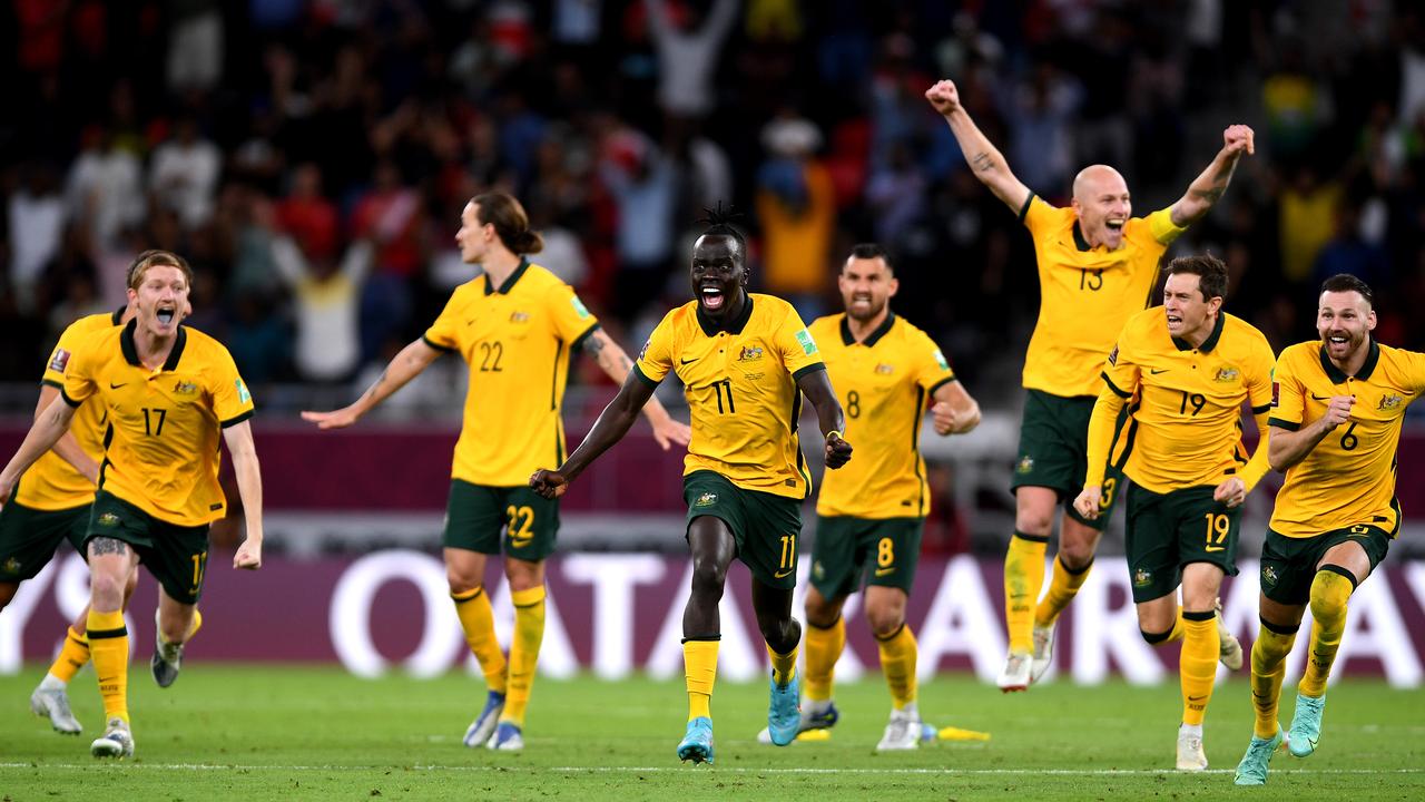 Irvine (background) took a moment to comprehend that the Socceroos were on their way to Qatar. Picture: Joe Allison/Getty Images