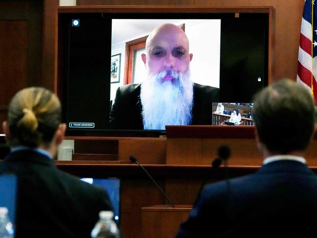 Travis McGivern, security for Johnny Depp, is seen on a monitor as he testifies remotely in the courtroom at the Fairfax County Circuit Court in Fairfax, Virginia. Picture: AFP