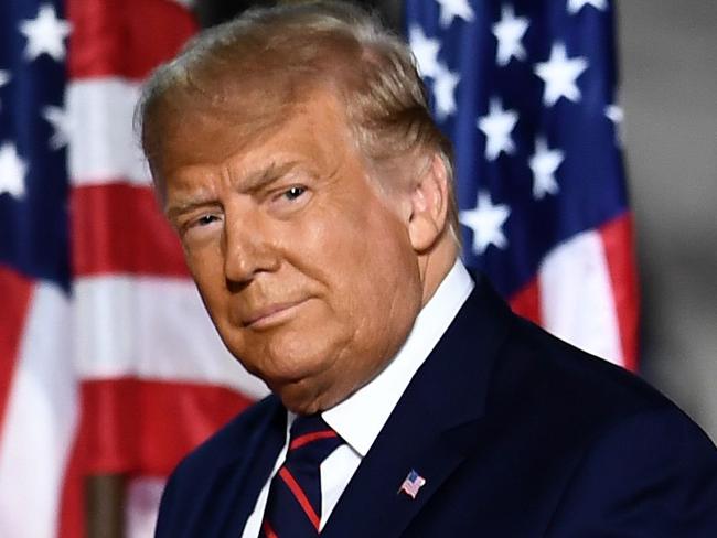 TOPSHOT - US President Donald Trump arrives to deliver his acceptance speech for the Republican Party nomination for reelection during the final day of the Republican National Convention at the South Lawn of the White House in Washington, DC on August 27, 2020. (Photo by Brendan Smialowski / AFP)