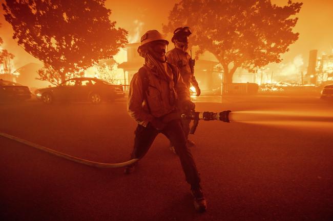 Firefighters battle flames in the Pacific Palisades neighbourhood of Los Angeles. Picture: AFP