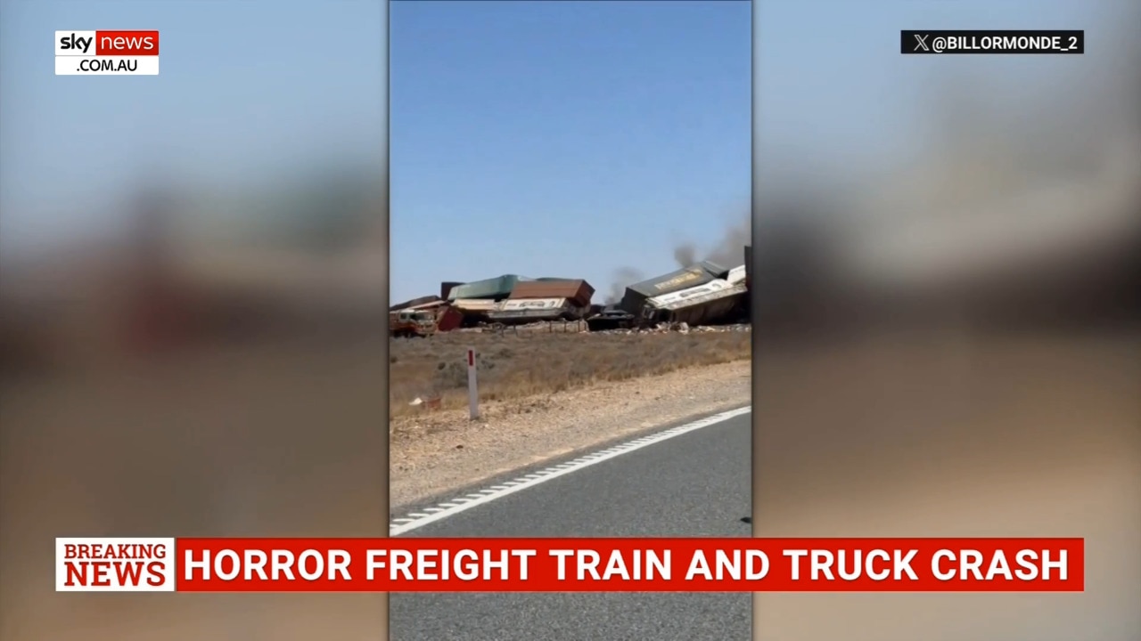 Two dead after crash between freight train and truck