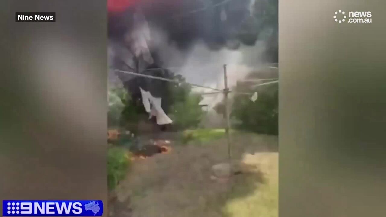 Hero tradies rescue woman from burning home