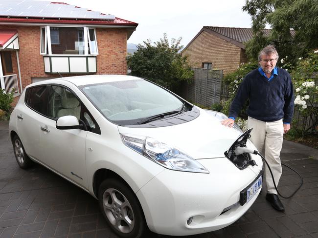 Clive Attwater of Bellerive with his Nissan Leaf electric car that is recharged using energy from the solar panels on his home. Picture: NIKKI DAVIS-JONES