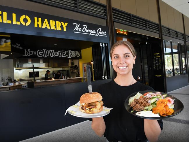 Hello Harry staff member Jasmine Clement serves up a couple of meals at the burger chain’s Sunshine Plaza store. Picture: Patrick Woods