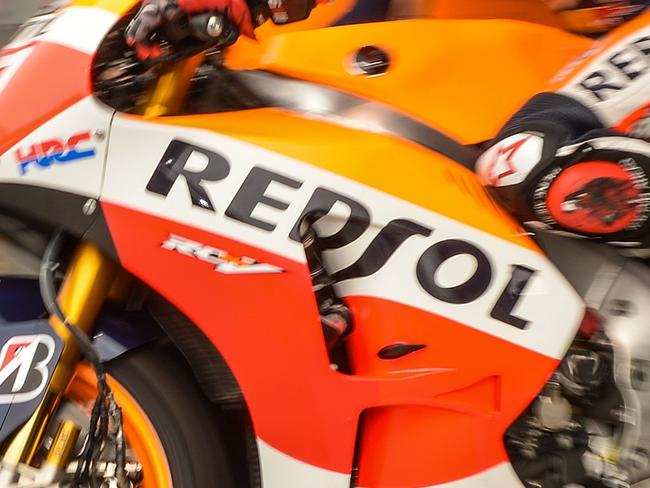 Repsol Honda Team's Spanish rider Marc Marquez leaves the pit lane during the third practice session of the Malaysian Grand Prix MotoGP motorcycling race at the Sepang International Circuit on October 24, 2015. AFP PHOTO / MOHD RASFAN