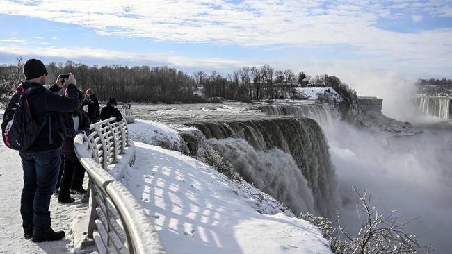 Tourists visit Niagara Falls as it is partially frozen due to extreme cold weather in the northeast of New York state. Picture: Getty Images