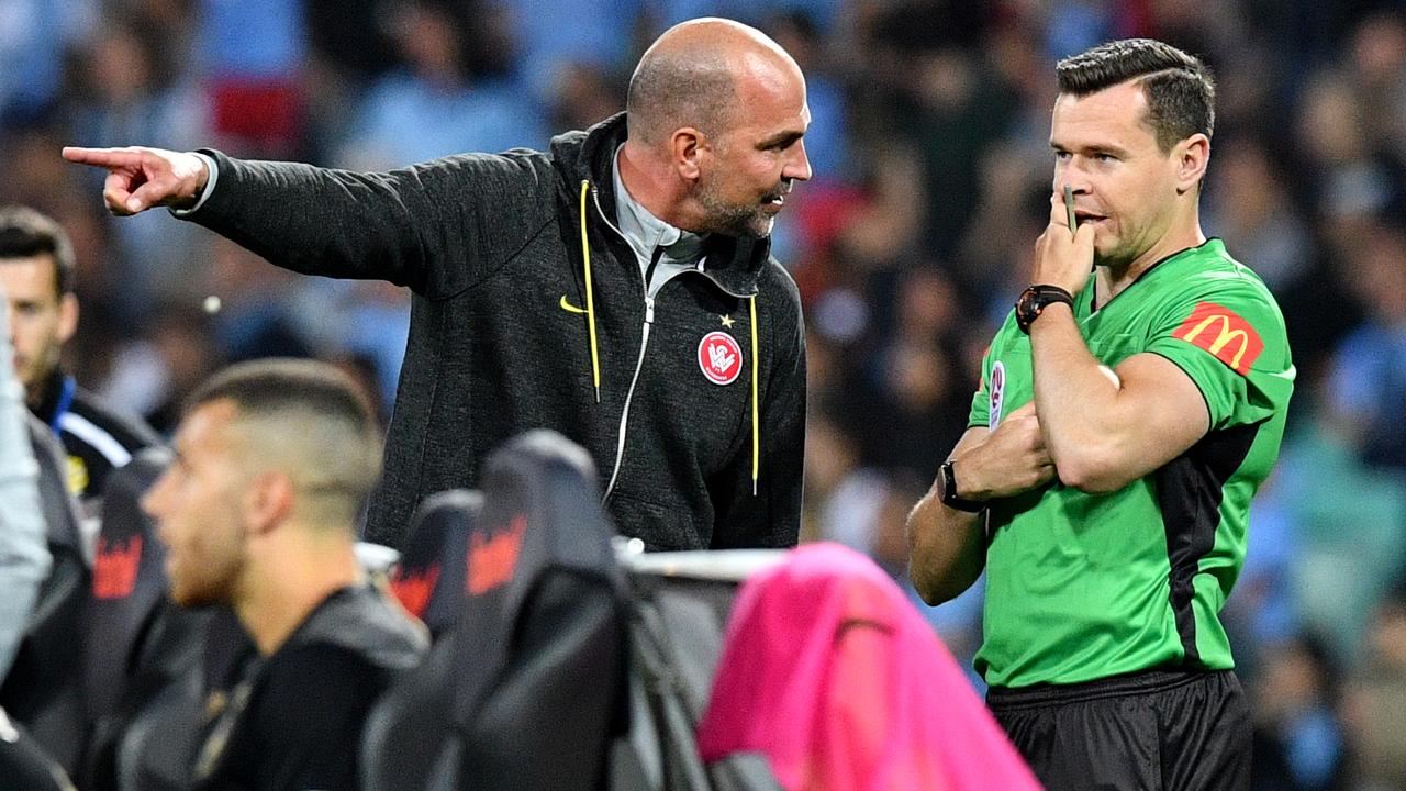 Wanderers head coach Markus Babbel argues with the fourth official.