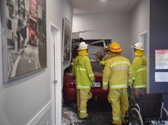 Six people assessed after driver ploughs through building