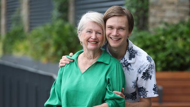 Malvene Dicker, 80, at home in Chermside West with her eldest grandson Zazh Vivian, 18. Malvene was a teleprinter operator who deciphered 'top secret' encryption codes for the Australian Women's Air Force during the Vietnam War. Picture: Liam Kidston