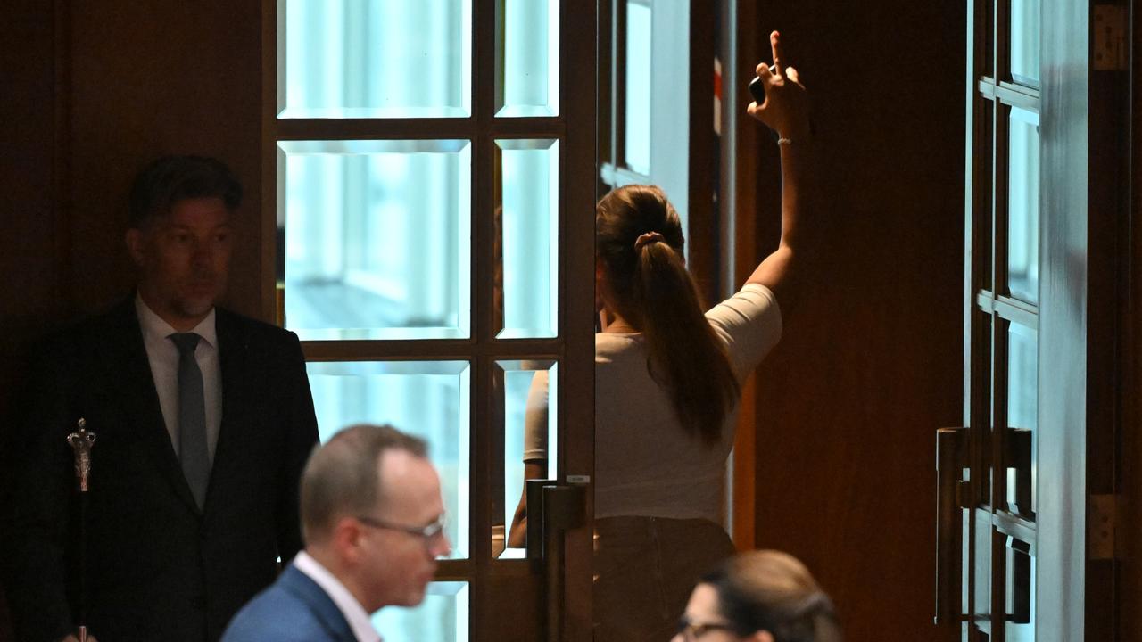 Independent Senator Lidia Thorpe walks out after throwing papers at One Nation leader Pauline Hanson in the Senate chamber at Parliament House in Canberra. Picture: AAP