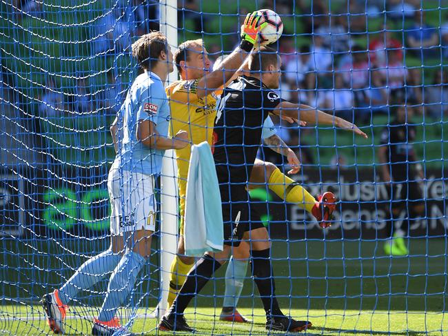 Eugene Galekovic of City (second from left) holds the ball on the line during the Round 11 A-League match between Melbourne City and the Newcastle Jets at AAMI Park in Melbourne, Sunday, January 6, 2019. (AAP Image/Julian Smith) NO ARCHIVING, EDITORIAL USE ONLY