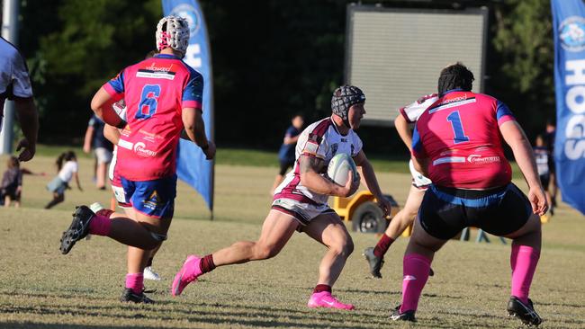 GCDRU (Gold Coast Rugby) first grade clash between Helensvale Hogs (pink) and Nerang Bulls. (white). Tazzy Jones. Pic Mike Batterham