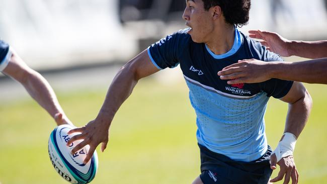 Ronan Leahy flick pass out the back in the match against the Rebels.