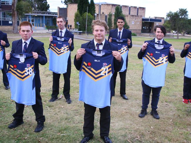 L-R Adam Jones, Thomas Cavanagh-Boyd, Adam Orchard, Dylan Donaldson, Jason Trindall, James McKay and Sevastien Camilleri pose for photographs at Doonside Technology High School. Doonside, Monday, June 4th 2018. Seven Doonside Technology High School students have been selected to represent NSW in the AFL National Inclusion Carnival. (AAP Image / Angelo Velardo)