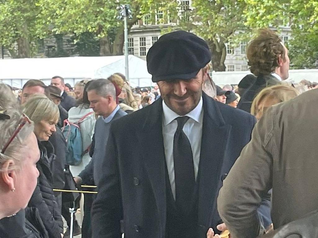 David Beckham in the queue to visit Queen Elizabeth lying in state at Windsor Castle.