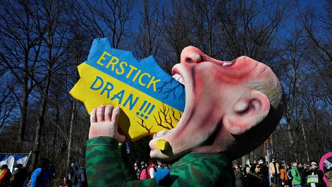 A giant figure representing Russian President Vladimir Putin swallowing a map of the Ukraine is seen during a demonstration against Russia's invasion in Dusseldorf, western Germany. Picture: AFP