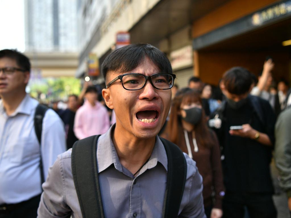 A man reacts at the site where a pro-democracy protesters was shot by a policeman in Hong Kong. Picture: Anthony Wallace/AFP