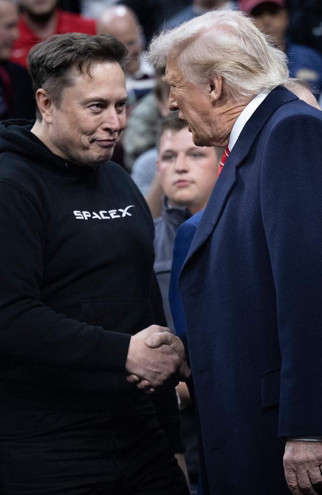 Elon Musk greets US President Donald Trump as he arrives to watch the men's NCAA wrestling competition in Philadelphia, Pennsylvania. Picture: AFP