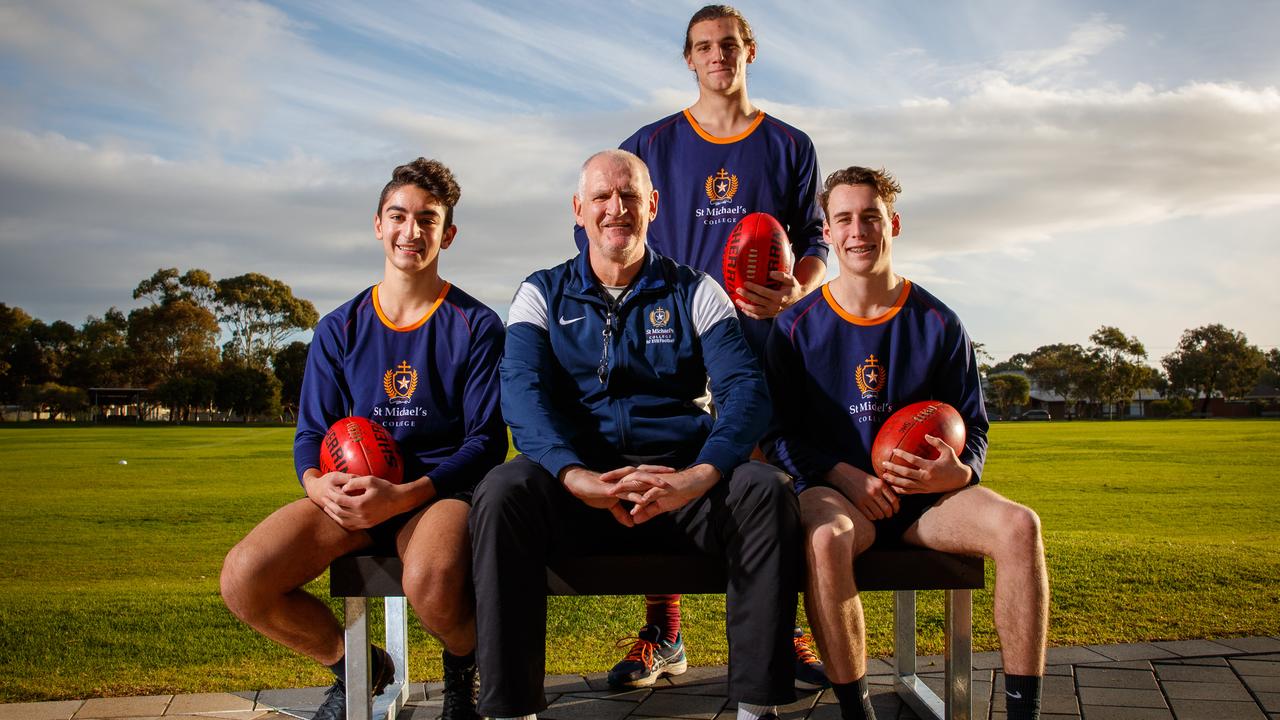 13/6/2019 Mark Mickan coaching at St Michael's College with players John Moschou, Indiana Dorian and Jack Balkwill. The West Adelaide premiership coach and ex-Crows star Mark Mickan has now coached two games since returning to coaching - eight weeks after having groundbreaking Parkinson's surgery. Picture MATT TURNER.