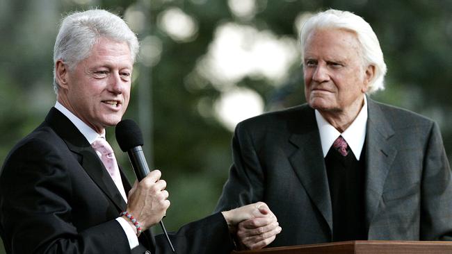 Bill Clinton speaks along with Billy Graham during Graham's Crusade at Flushing Meadows Corona Park in the Queens borough of New York. Picture: AFP.