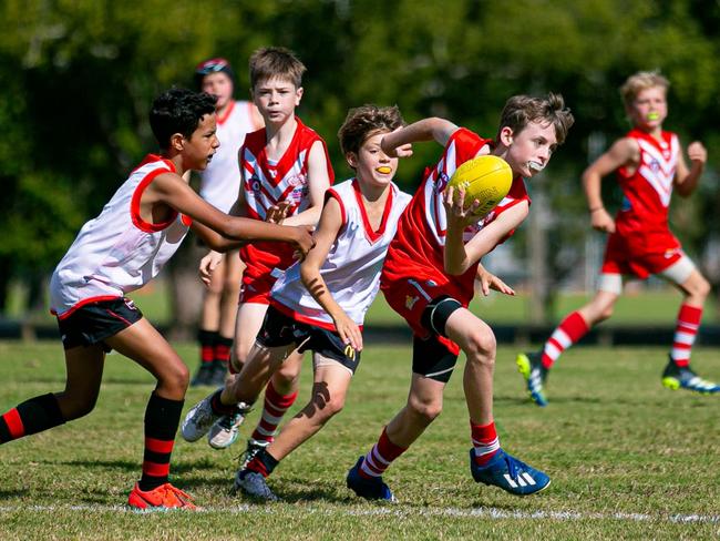 POWER PLAY: Lismore Swans Junior AFL U11 players Fynn Henderson and Sidney-Jack Bakers were part of an energetic team who hosted he Burleigh Bombers Black squad in Round 5 at Mortimer Oval  on Sunday May 23, 2021. Photo: Ben Lynch