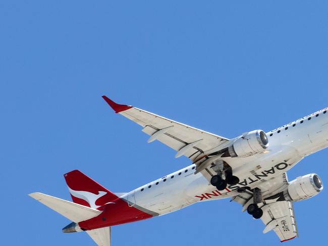 BRISBANE, AUSTRALIA - NewsWire Photos SEPTEMBER 30, 2024: A Qantas plane prepares to land in Brisbane. Hundreds of Qantas workers went on strike today demanding higher wages. Picture: NewsWire/Tertius Pickard