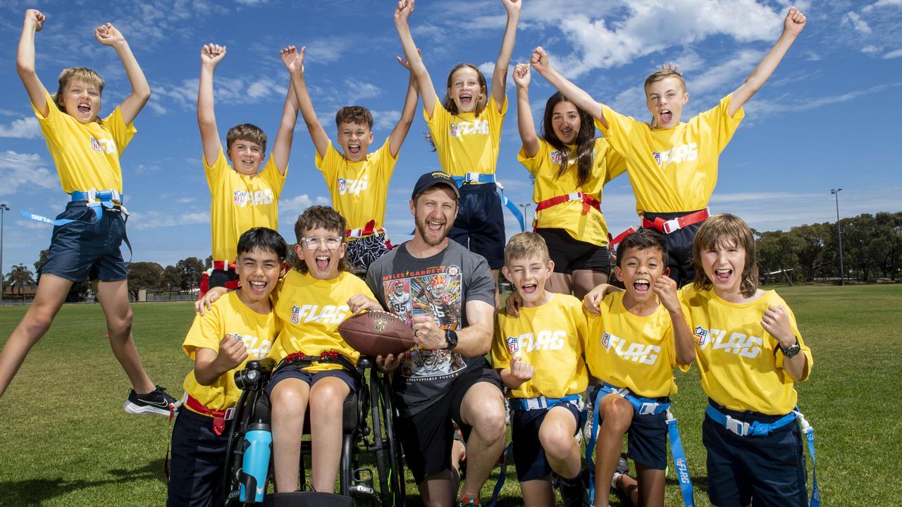 Kidman Park Primary School NFL Flag coaches Sean Yates-Bock and Alex Kouts with their team. Picture: Mark Brake