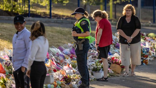 An emotional young female police officer, who was a first responder, to a freak accident where a gust of wind swept away a jumping castle at Hillcrest Primary School in Tasmania. Picture: Jason Edwards