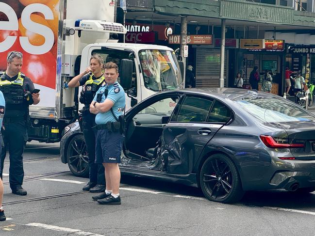 Three children have been arrested after fleeing a BMW with one of its doors ripped off in the city., Police followed the car from Thornbury and through the CBD on Wednesday morning until it stopped in Elizabeth street. Picture: Cameron Tandy