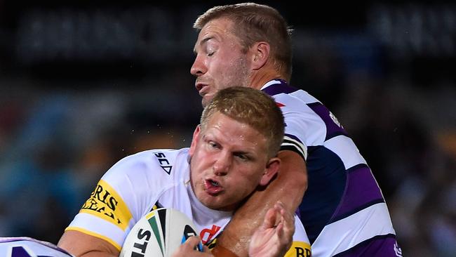 TOWNSVILLE, AUSTRALIA - MARCH 30: Ben Hannant of the Cowboys Ryan Hinchcliffe and Kurt Mann of the Storm during the round four NRL match between the North Queensland Cowboys and the Melbourne Storm at 1300SMILES Stadium on March 30, 2015 in Townsville, Australia. (Photo by Ian Hitchcock/Getty Images)