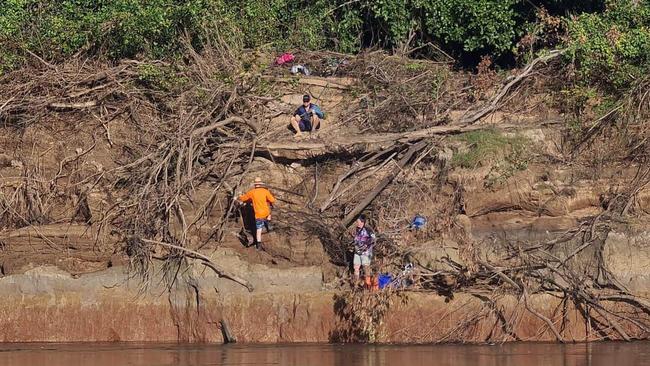 The NT Towing 4x4 Recovery team removed a boat from a sandbank in Daly River, where it sat about 1.5m above water level. The team had equipment set up on the sandbank and on the other side of the river along a short cliff edge. Picture: NT Towing 4x4 Recovery/Facebook