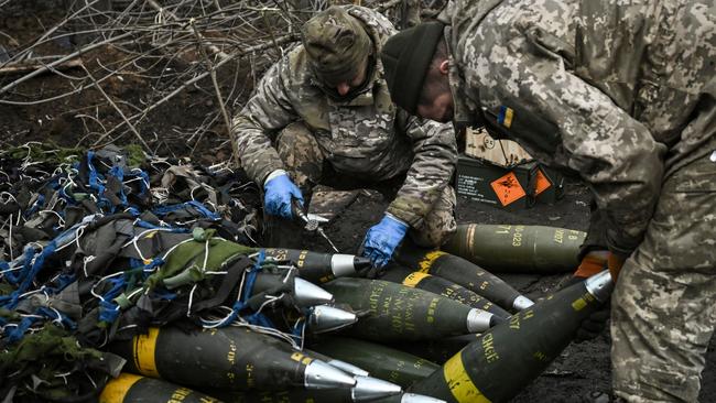 Members of Ukraine’s army prepare to fire towards Russian positions. Picture: AFP