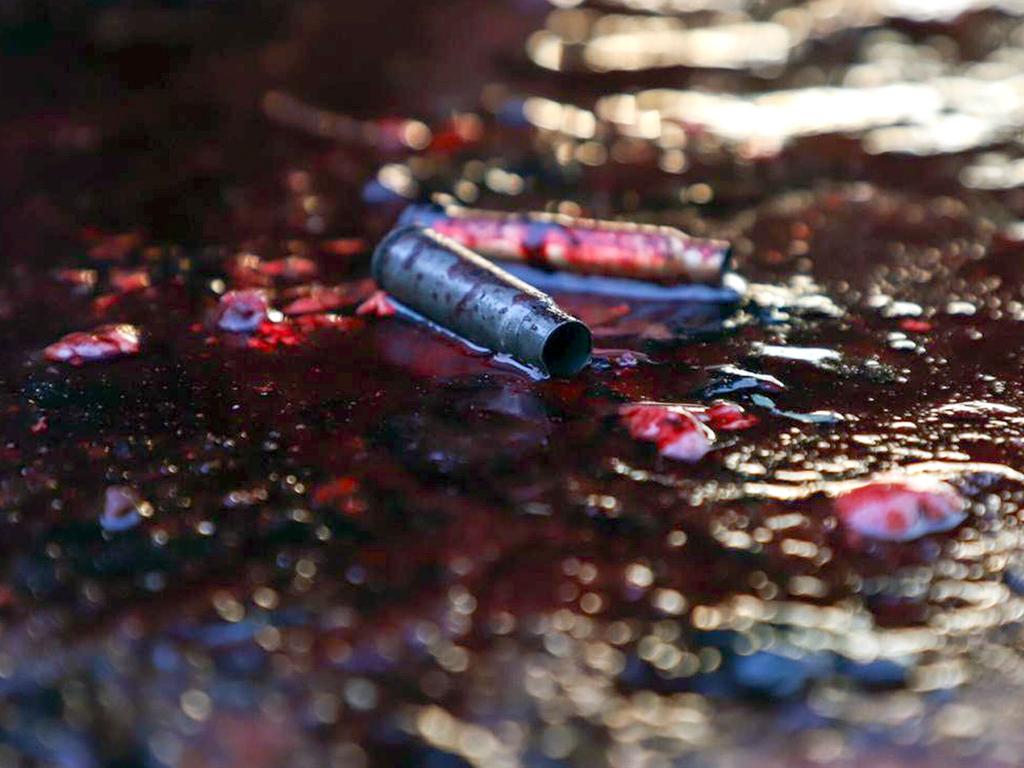 Ammunition shells lay on a pool of blood in a street of Culiacan, capital of jailed kingpin Joaquin "El Chapo" Guzman's home state of Sinaloa. Picture: AFP