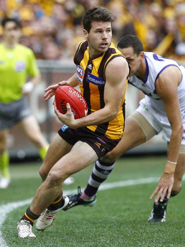 Jonathan Simpkin skips away from Michael Johnson during the 2013 AFL decider. Picture: Michael Klein.