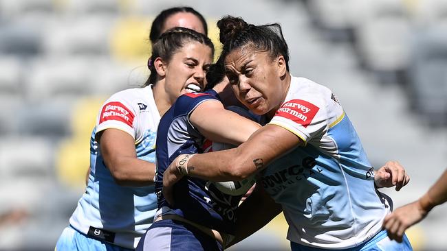 TOWNSVILLE, AUSTRALIA - AUGUST 17: Lily Peacock of the Cowboys is tackled by Shannon Mato of the Titans during the round four NRLW match between North Queensland Cowboys and Gold Coast Titans at Queensland Country Bank Stadium on August 17, 2024 in Townsville, Australia. (Photo by Ian Hitchcock/Getty Images)