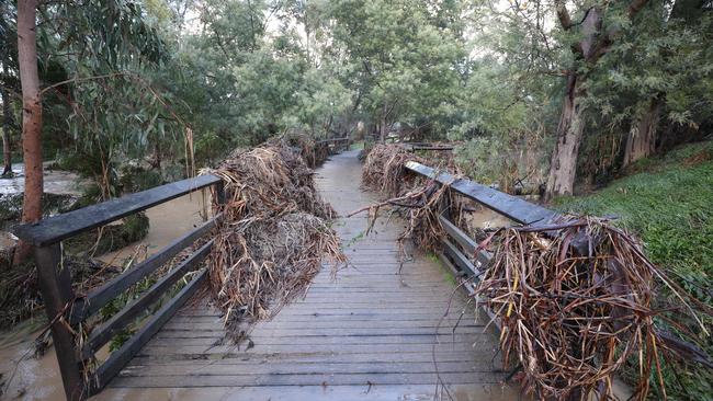 Debris tangled around a footbridge on a walking track beside Traralgon Creek. Picture: David Caird